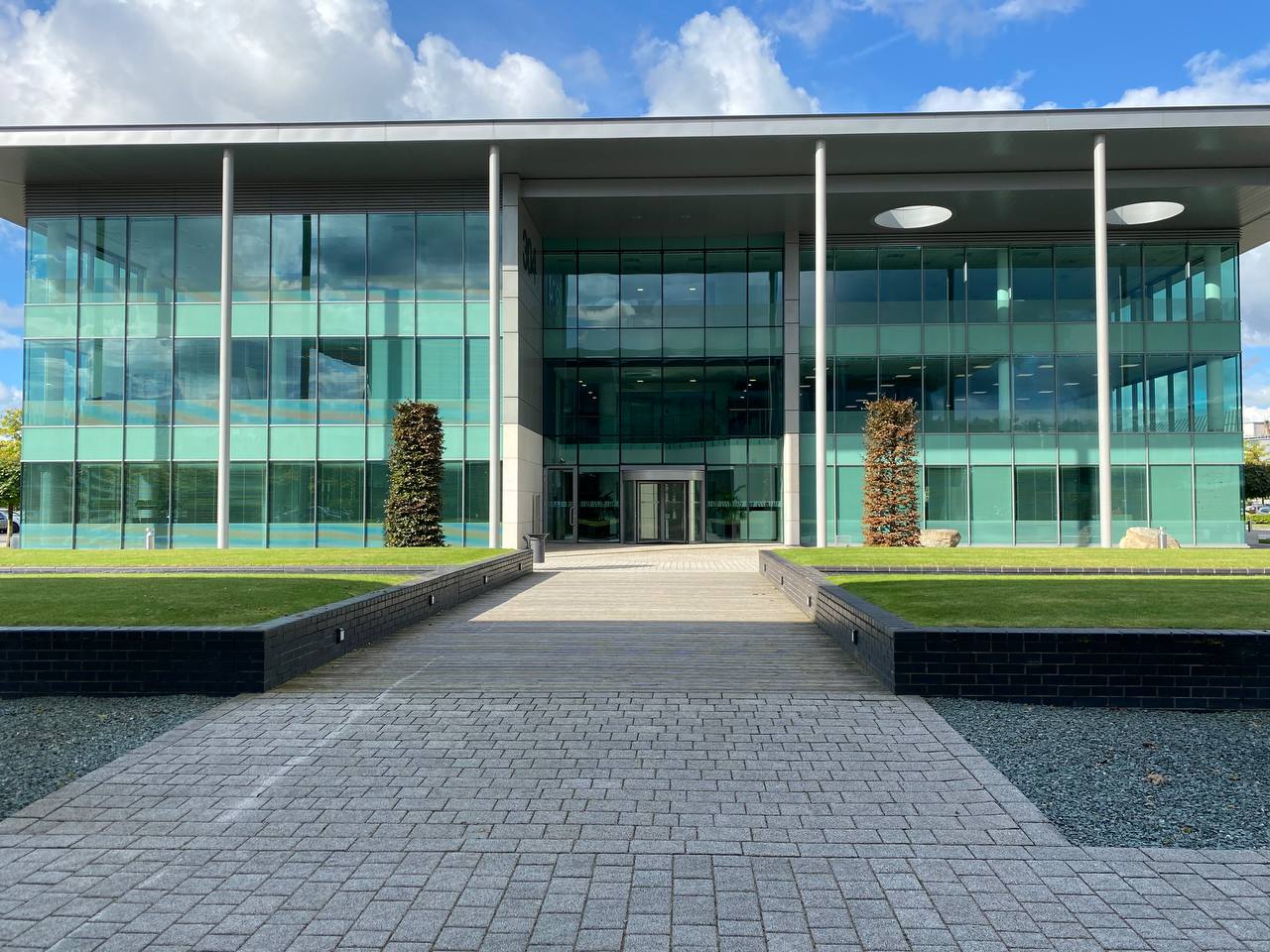 Trading Floor showing the entrance to the office, modern glass building